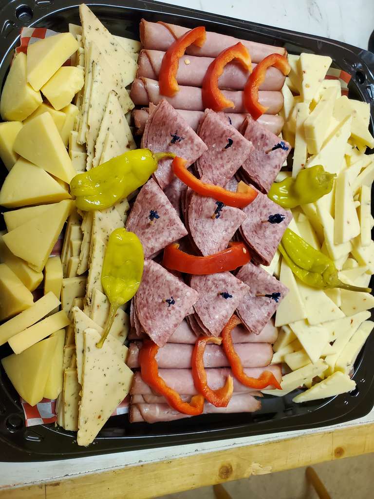 Visit the Photo Gallery page to view our latest cheese and deli displays.