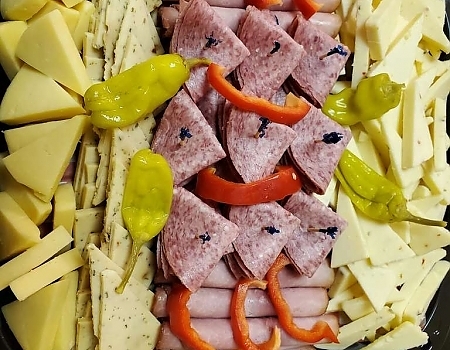 Visit the Photo Gallery page to view our latest cheese and deli displays.